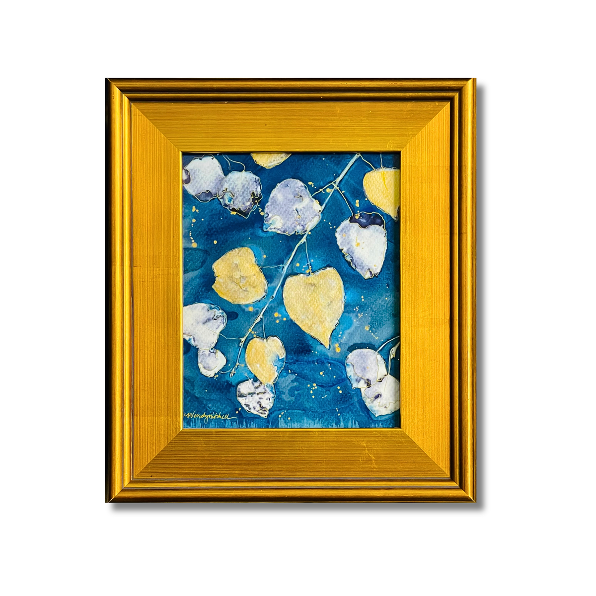 A square framed painting featuring an abstract composition of blue, yellow, and white aspen leaves on a textured blue background, enclosed in a wide gold frame against a white background.