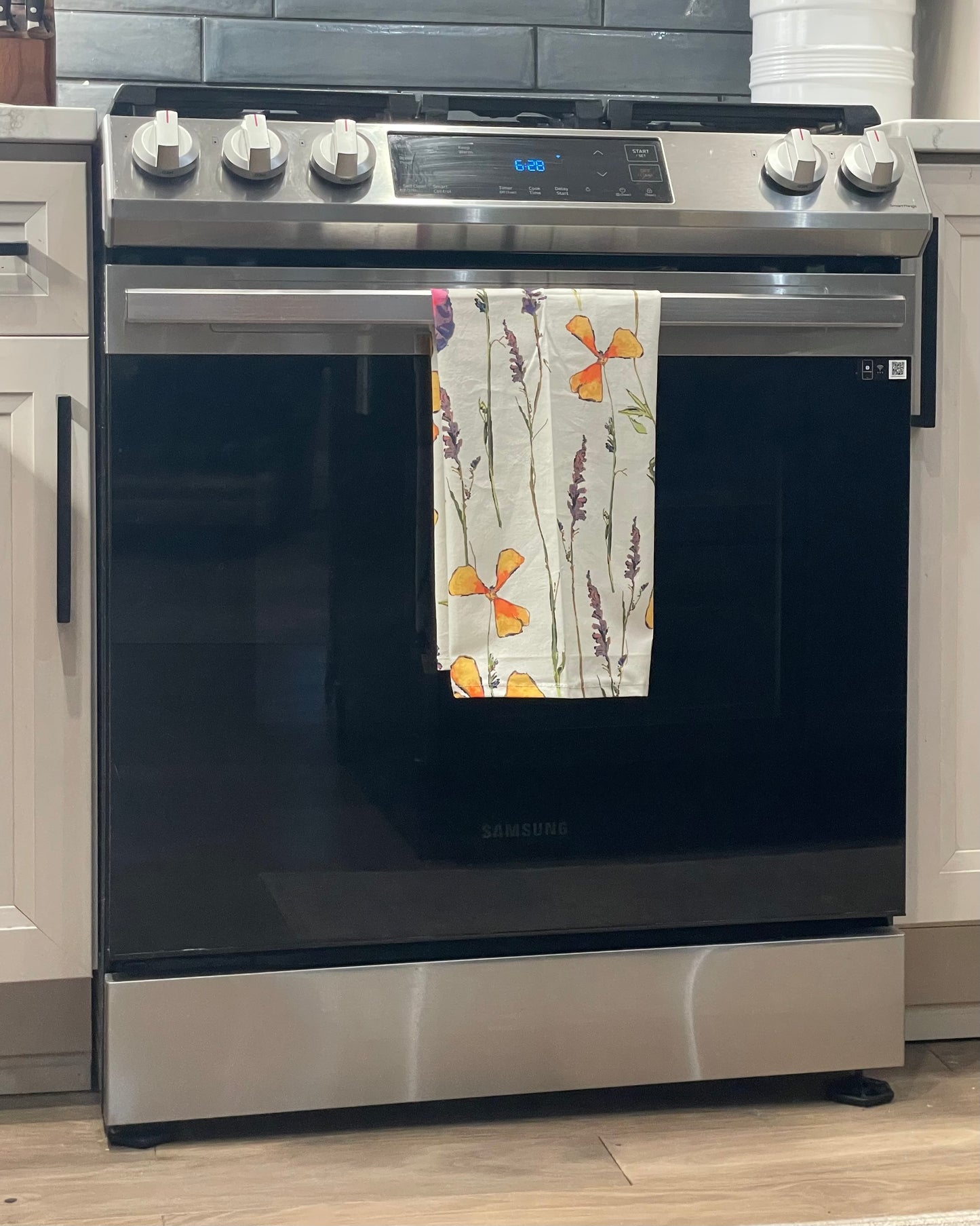 A flour sack tea towel with a floral design. Wendy MItchell Art, Salida CO