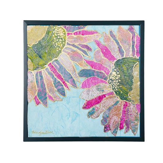 Framed artwork with colorful floral design on a light blue background
