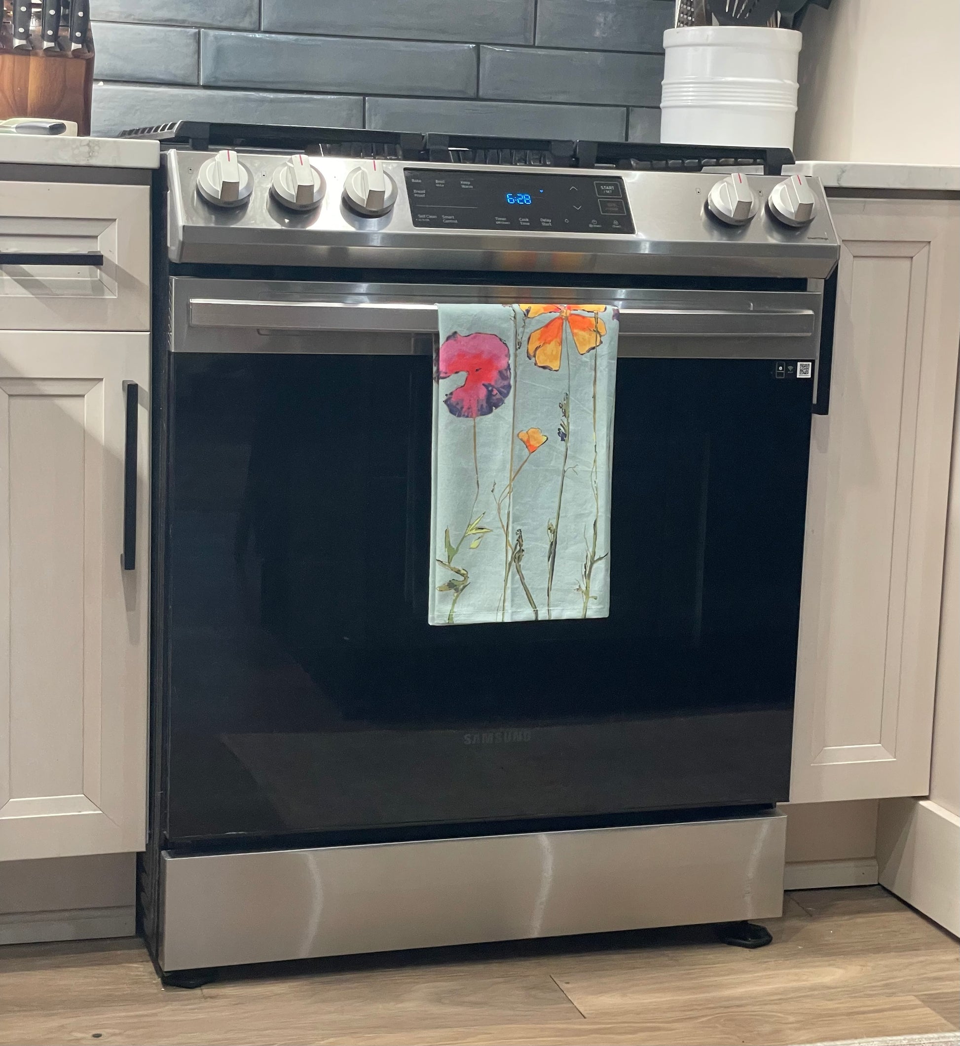 A flour sack tea towel with a floral design. Wendy MItchell Art, Salida CO